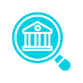 Magnifying glass hovering over a building, suggesting that the building is being examined closely
